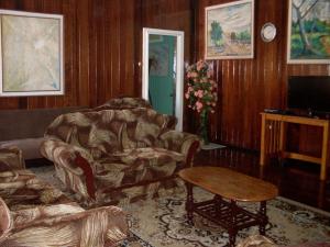 a living room with a couch and a table at Arlington Apartments in Georgetown