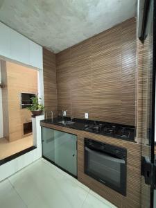 a kitchen with a stove and a sink at Casa Aurora Provetá - Ilha Grande in Angra dos Reis +14 photos