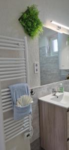 a bathroom with a sink and a mirror and a sink at Bike & Chill Apartment in Balatonfüred +63 photos