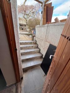 a stairway leading up to a building with a door at Cosy Family Basement Apartment in Copenhagen Søborg with Jacuzzi in Søborg
