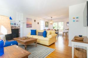 a living room with a couch and a table at Spacious w Beautiful Yard & Dogs Welcome in Harwich