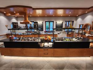 a kitchen with a large island in a room at Hotel Seeblick in Bad Reichenhall