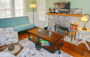 a living room with a couch and a fireplace at Bungalows on the Square- Unit 1 in Wimberley