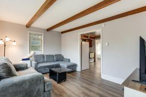 a living room with a couch and a tv at Warren County Launchpad: Pet-Friendly Lebanon Apt in South Lebanon