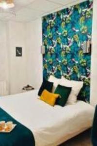 a bedroom with a large white bed with a blue curtain at Savana Lodge, Wi-Fi, Parking Privé et Calme, Sortie 12 ChanaS in Chanas