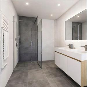 a bathroom with a shower and a sink at Chalet Villa Hera in Bichlbach