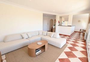 a living room with a white couch and a table at Luxury Sea View Villa Oltamar - Single Level - Private Pool - Full Privacy in Calpe