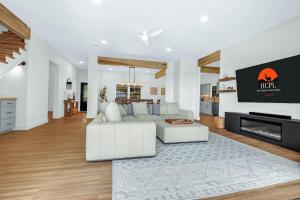 a living room with a white couch and a fireplace at Jalsa in Wimberley