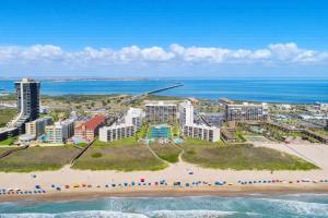 an aerial view of a beach with buildings and the ocean at Saida Towers III- 3101 condo in South Padre Island