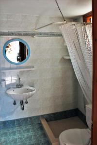a bathroom with a sink and a toilet at Poseidon Studios in Kokkari +27 photos