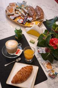 a table with a plate of bread and a cup of coffee at Foresteria 33 in Ghedi +33 photos