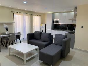 a living room with a couch and a table at Condominio cortico in Mendoza