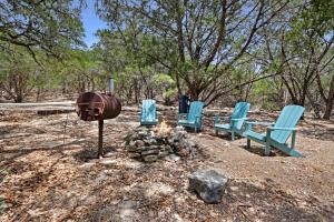 a group of chairs sitting around a fire in a yard at Lajitas at The Bend in Wimberley +23 photos