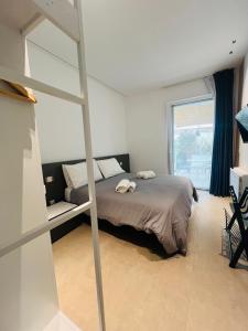 a bedroom with a bunk bed and a window at Respiro Greco in Syracuse