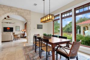 a dining room with a table and chairs at Narwhal Ranch in Wimberley