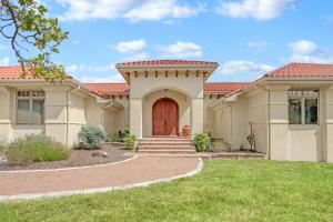 a large house with a red roof at Narwhal Ranch in Wimberley