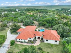 an aerial view of a house with an orange roof at Narwhal Ranch in Wimberley
