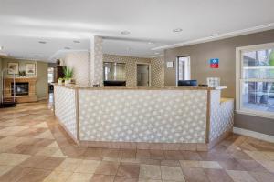 a hotel lobby with a large reception counter at SureStay Plus Hotel by Best Western Mountain View in Mountain View +22 photos