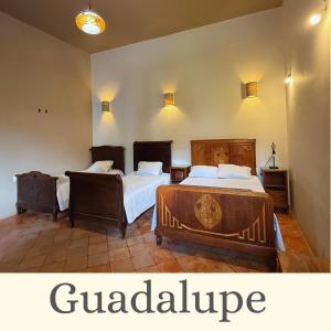 two beds in a room with two beds sidx sidx sidx at La Casa de Ticho in Mascota +11 photos