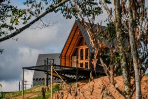 a house on top of a hill at Ecolodge Ix Cacao in San Carlos