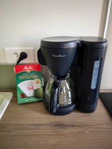 a coffee maker sitting on top of a counter at Maisonnette Montferrandaise proche Tram - 6 couchages - tram - wifi in Clermont-Ferrand