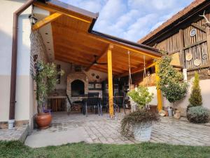 an open patio with a table and chairs at Apartman Katarina Bački Monoštor in Bački Monoštor