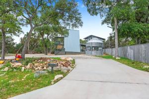 a walkway leading to a house with a building at Lakeview A-Frame in Canyon Lake