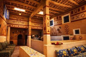 a large room with writing on the wall at Riad DAR outebba in Zaouïet Sidi Daoud