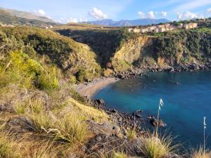 a view of a beach on a cliff at Casa Blu Mare privat beach 9 person in San Nicola Arcella