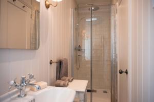 a bathroom with a sink and a shower at Drumornie in Brora +34 photos