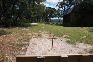 a sand trap in the middle of a field at Lavender in Wimberley