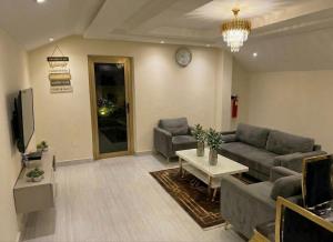 a living room with a couch and a table at LKL appartements in Kinshasa