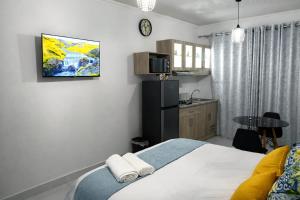 a bedroom with a bed with two towels on it at 27 on Donaldbain in Welkom