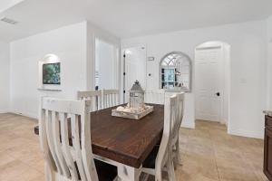 a dining room with a wooden table and chairs at Pampered Pillow in Canyon Lake