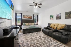 a living room with a couch and a bed at Pampered Pillow in Canyon Lake