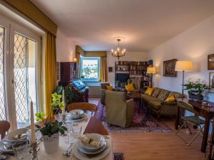 a living room with a table and a couch at Apartment "Maria Theresia" in Graz