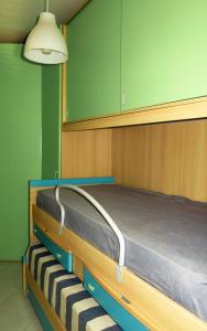 a bedroom with a bed with a wooden frame at Villa Anna "Davvero sulla Spiaggia" in Vasto