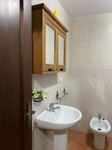 a bathroom with a sink and a toilet at Apartamento Tarramilla in Prado del Rey +25 photos