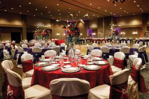 a banquet hall with tables and white chairs at Hilton Phoenix Tapatio Cliffs Resort in Phoenix +125 photos
