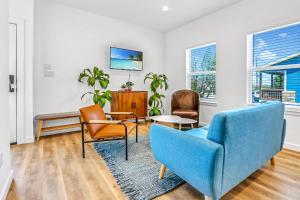a living room with a blue couch and chairs at Pitch Perfect in Canyon Lake +13 photos