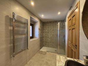 a bathroom with a shower and a sink at Caserio Uletza in Rigoitia +53 photos