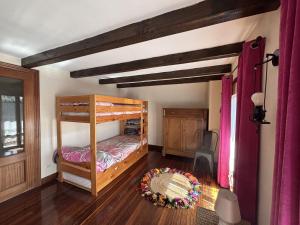 a bedroom with a bunk bed in a room at Caserio Uletza in Rigoitia