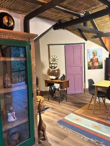 a room with a play room with a table and a door at Chalé - Refúgio Serra das Águas in Araras Petropolis +8 photos