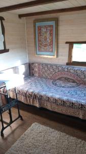 a bedroom with a large bed in a room at Tiny house Suria - Český ráj in Prackov
