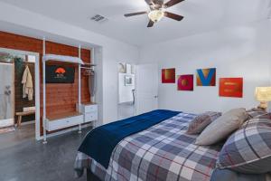 a bedroom with a bed and a ceiling fan at Windmill Ranch - Terra Casita #2 in Wimberley