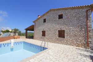 a house with a swimming pool next to a building at Villa Katerina in Chania