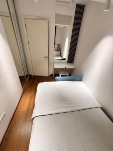 a bedroom with two beds and a mirror at Tower II in Banja Luka
