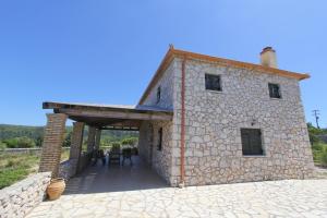a large stone building with a wooden at Villa Katerina in Chania