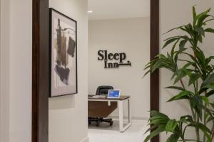 an office with a desk and a laptop at Sleep Inn Apart-Hotel in Cairo