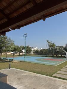 a basketball court in a park with a basketball hoop at Palm Stone Villa in Lucknow
